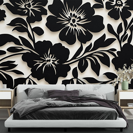Black and white floral wallpaper creating dramatic impact in a modern living room with minimalist furniture