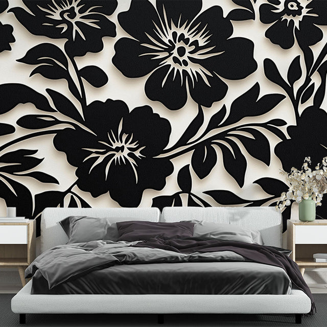 Black and white floral wallpaper creating dramatic impact in a modern living room with minimalist furniture