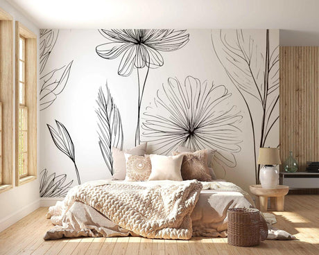 Black and white floral line art wallpaper creating a stunning focal point in a modern living room with minimal furniture