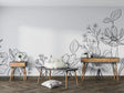 Modern black and white botanical line art wallpaper creating a sophisticated backdrop in a minimalist living room