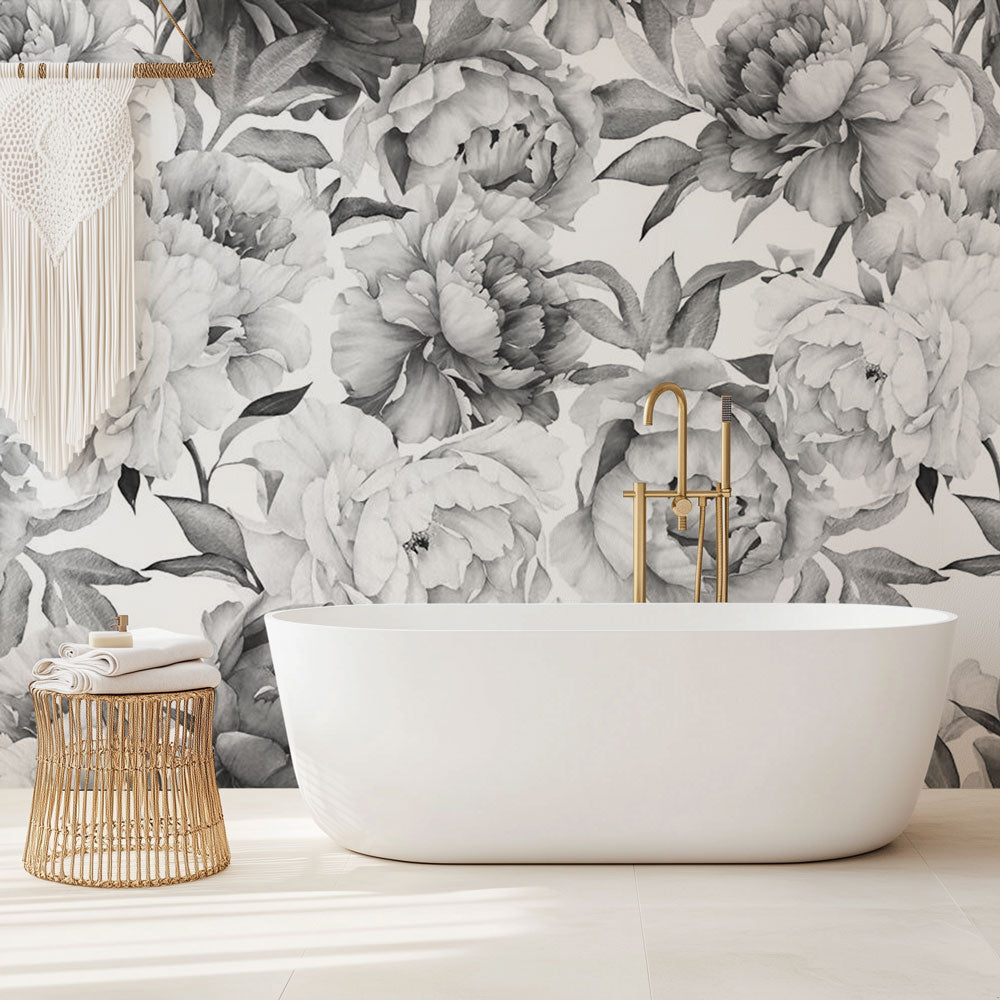 Black and white peony wallpaper mural in modern living room, creating dramatic contrast against neutral furniture