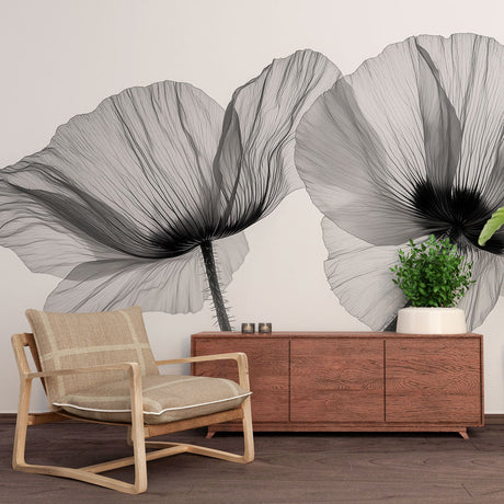 Black and white poppy X-ray wallpaper mural in a modern minimalist bedroom, creating a peaceful gallery atmosphere