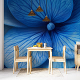 Blue and gold abstract floral wallpaper creating a peaceful atmosphere in a modern living room with minimal furniture