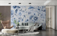 Blue floral wallpaper mural in modern living room showing soft botanical pattern against white walls