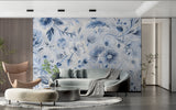 Blue floral wallpaper mural in modern living room showing soft botanical pattern against white walls