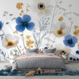 Blue and white floral wallpaper with gold accents creating an elegant atmosphere in a bright modern living room