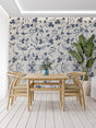 Blue bird floral wallpaper in bright modern living room showing pattern depth and scale