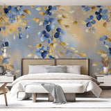 Blue and gold floral wallpaper mural creating an elegant atmosphere in a bright master bedroom with modern furniture