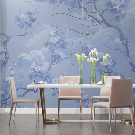 Blue cherry blossom wallpaper with gold waves creating a peaceful atmosphere in a modern living room