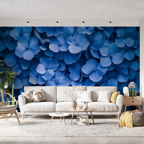 Blue Hydrangea Floral Wallpaper creating a stunning accent wall in a bright modern living room with white furniture