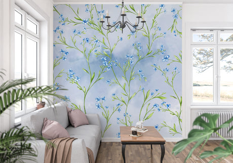 Blue Liberty floral wallpaper in bright modern living room creating fresh garden atmosphere