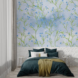 Blue floral wallpaper creating serene atmosphere in reading nook