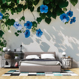 Blue Morning Glory floral wallpaper creating a fresh garden feel in a bright modern bedroom with natural light