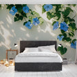 Blue Morning Glory floral wallpaper creating a peaceful atmosphere in a sunny living room with white furniture