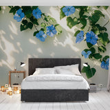 Blue Morning Glory floral wallpaper creating a peaceful atmosphere in a sunny living room with white furniture