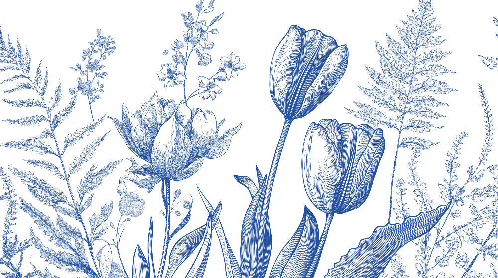 Blue tulip botanical wallpaper mural styled in bright modern living room with white furniture and natural light