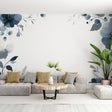 Blue watercolor floral wallpaper creating a peaceful atmosphere in a bright modern living room with white furniture