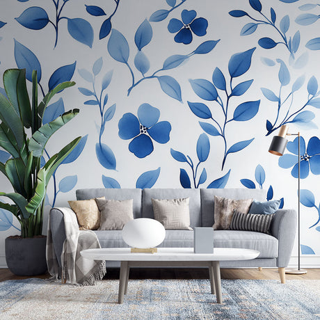Blue floral wallpaper mural creating a serene atmosphere in a modern bedroom with natural light and minimal furniture