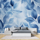 Blue floral wallpaper creating flow in an open-concept living space