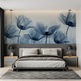 Reading nook with blue watercolor poppy wall design creating a cozy corner
