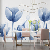 Reading nook with blue botanical wallpaper creating serene atmosphere