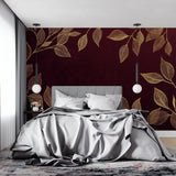 Burgundy and gold leaf wallpaper in an elegant dining room with crystal chandelier