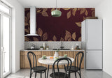 Luxury home office with burgundy and gold leaf pattern wall mural