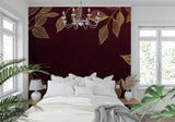 Hallway decorated with deep red and gold botanical wall covering