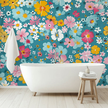 Floral wall mural with yellow and pink blooms on teal background brightening a modern living room with natural light