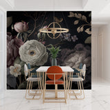 Dark floral wall design in dining room setting with crystal chandelier