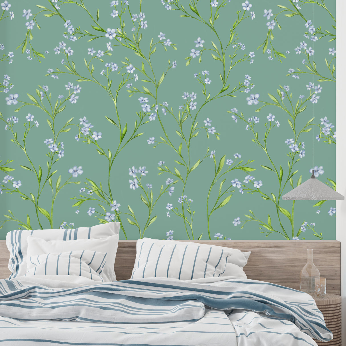 Sage green and blue floral wall mural in a cozy bedroom setting