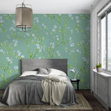 Delicate blue blossom wallpaper featured in a bright dining room