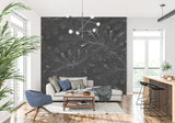 Dramatic black floral damask wallpaper creating luxury feel in master bedroom