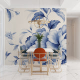 Blue floral wall mural in dining room with natural lighting