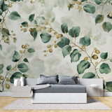 Botanical wallpaper with green leaves and gold berries in a bright modern living room