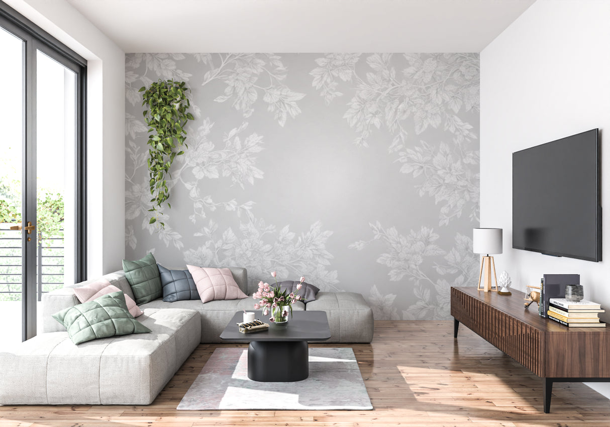 Elegant grey leaf pattern wallpaper in a cozy bedroom setting with soft furnishings