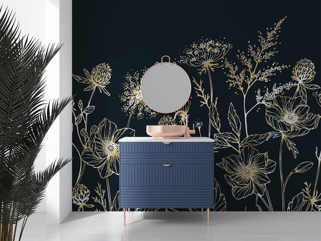 Gold floral line art wallpaper bringing elegance to a modern dining room with navy accent wall