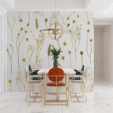 Botanical wall mural in cozy bedroom setting with golden accents