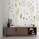 Golden botanical wallpaper in stylish living room setup
