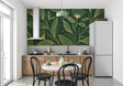 Luxurious green and gold botanical wallpaper creating a stunning backdrop in a modern living room setting