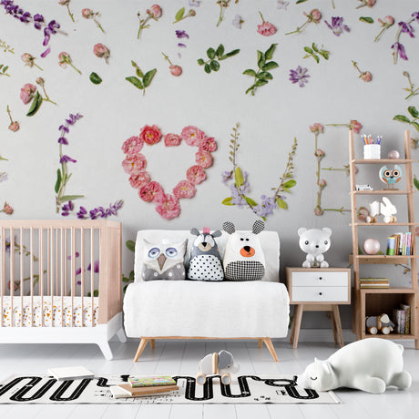 Pink roses Love Letters floral wallpaper in a bright nursery with white furniture