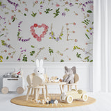 Romantic floral wall mural featuring pink roses in a girl's bedroom