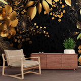 Black and gold floral wallpaper in a modern dining room, metallic blooms catching light from a crystal chandelier