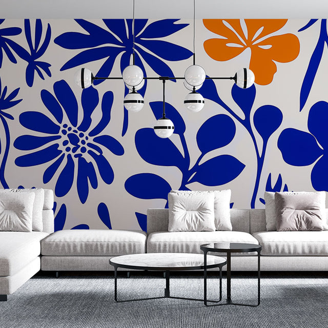Modern floral wallpaper with blue and orange blooms creating a stunning accent wall in a bright living room