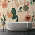 Modern botanical wallpaper with terracotta flowers in a bright dining room, showing how floral murals create a welcoming atmosphere
