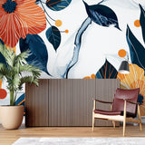 Navy and orange botanical wallpaper creating a statement wall in a home office space