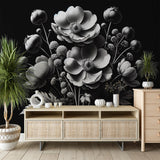 Black and white floral wallpaper in modern living room creating dramatic contrast against neutral furniture