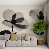 Black and white floral wallpaper creating dramatic impact in a modern living room with minimal furniture