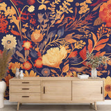 Navy and gold floral wallpaper in a bright living room, showing botanical pattern with golden blooms against deep blue background