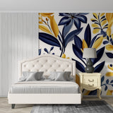 Elegant dining room featuring navy and gold botanical wallpaper with crystal chandelier